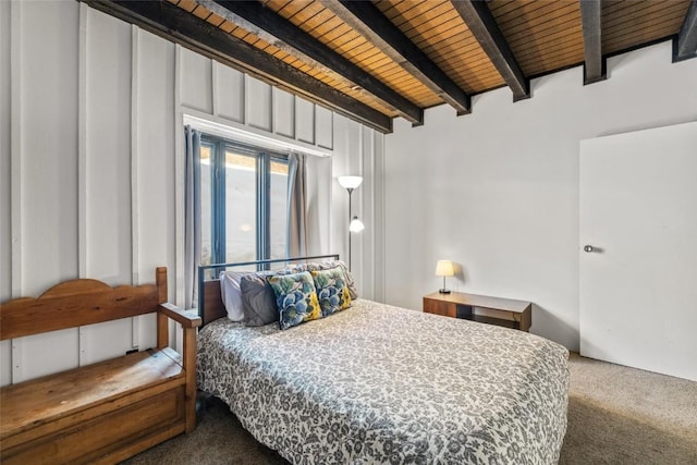 bedroom featuring beamed ceiling, wooden ceiling, and carpet flooring