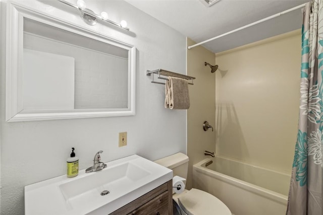 bathroom featuring vanity, toilet, and shower / bath combo with shower curtain