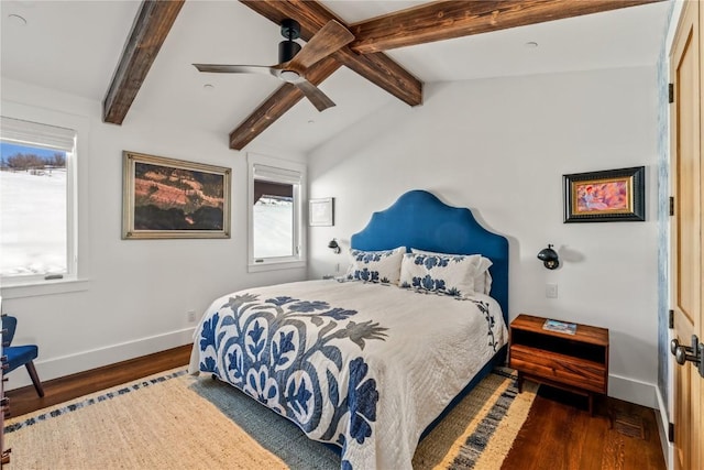 bedroom featuring dark wood-type flooring, lofted ceiling with beams, and ceiling fan