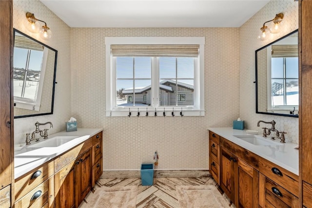 bathroom with vanity and a wealth of natural light