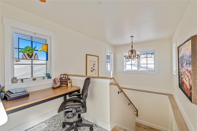 office space with a chandelier