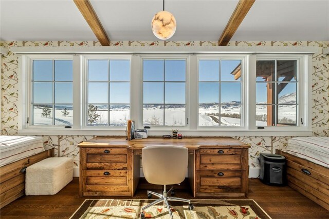 home office with dark hardwood / wood-style flooring and beamed ceiling