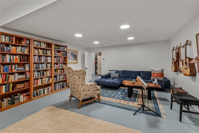 sitting room featuring concrete floors