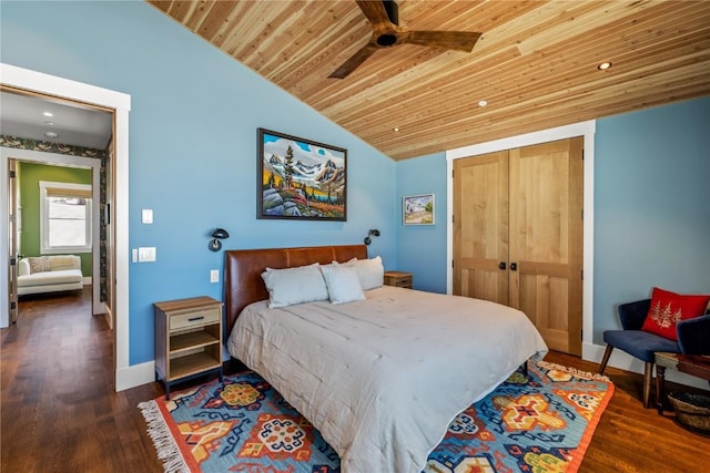 bedroom featuring wood ceiling, lofted ceiling, dark hardwood / wood-style floors, and a closet