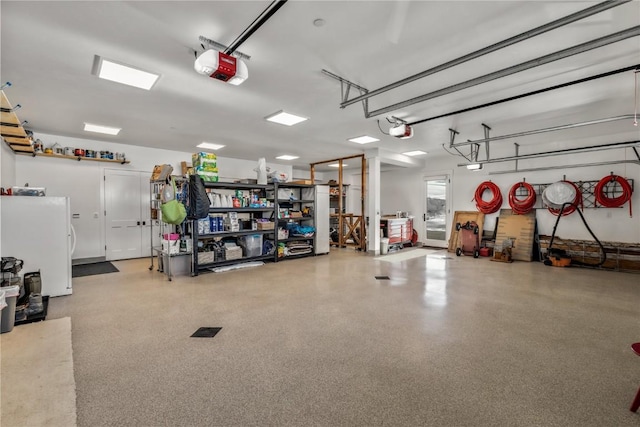 garage featuring a garage door opener and white refrigerator