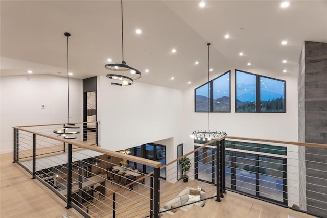 hallway with lofted ceiling