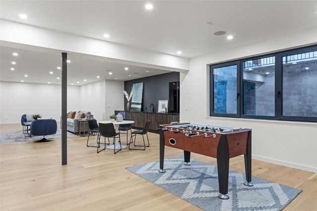 game room featuring light hardwood / wood-style floors