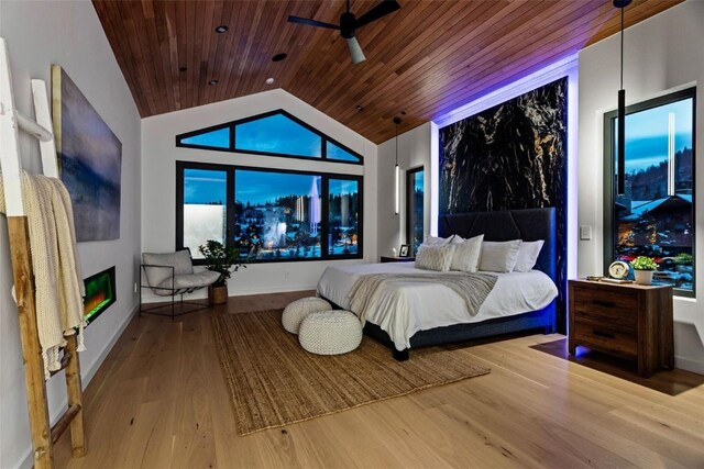 bedroom featuring hardwood / wood-style flooring, lofted ceiling, and wood ceiling