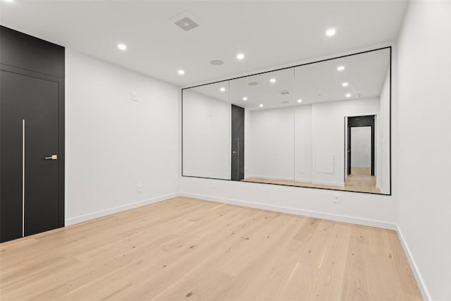 spare room with light hardwood / wood-style floors