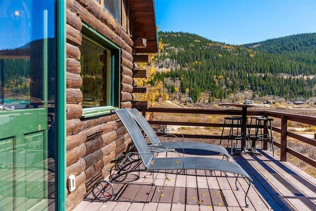 wooden terrace featuring a mountain view