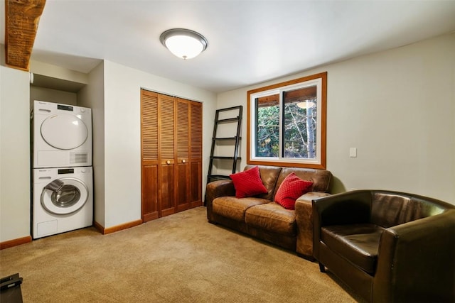 living room featuring light colored carpet and stacked washer / drying machine