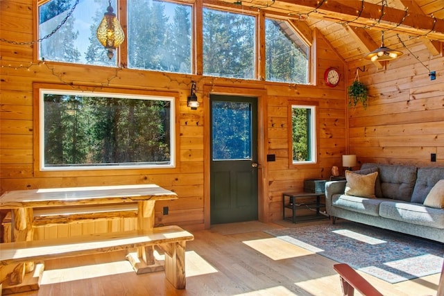 interior space with lofted ceiling with beams and wooden ceiling