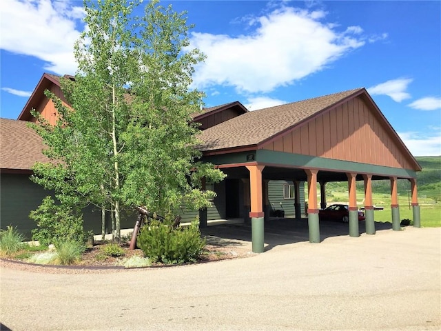 view of property's community with a carport and driveway