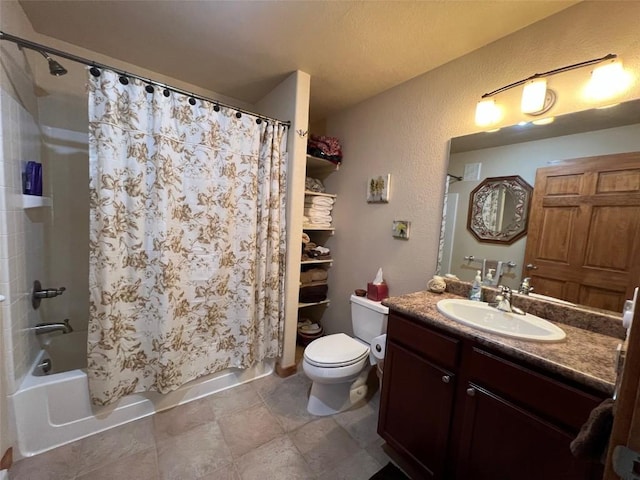 bathroom with toilet, a textured wall, shower / bathtub combination with curtain, and vanity