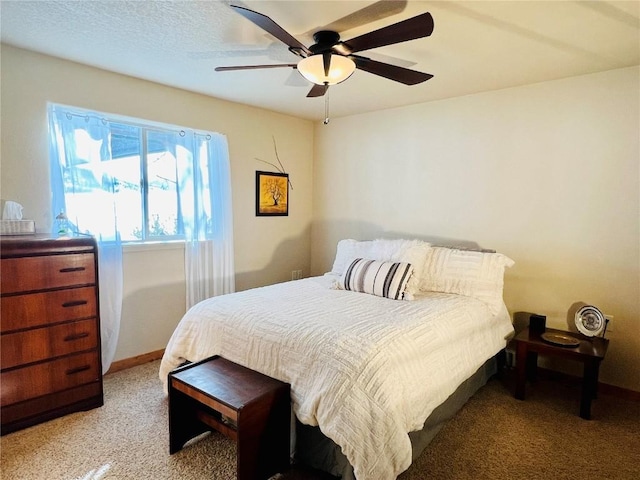 bedroom featuring light carpet and a ceiling fan