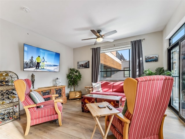 sitting room featuring ceiling fan and light hardwood / wood-style flooring