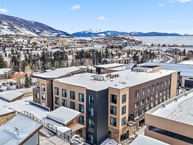 snowy aerial view with a mountain view