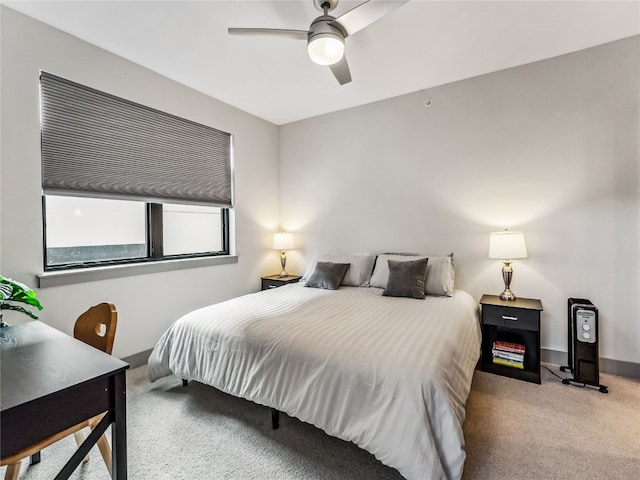 bedroom with ceiling fan and light colored carpet