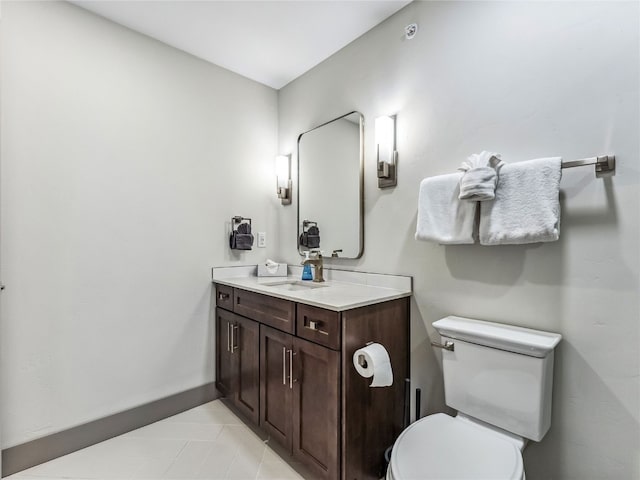 bathroom with toilet and vanity