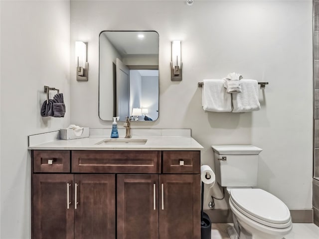 bathroom with toilet and vanity