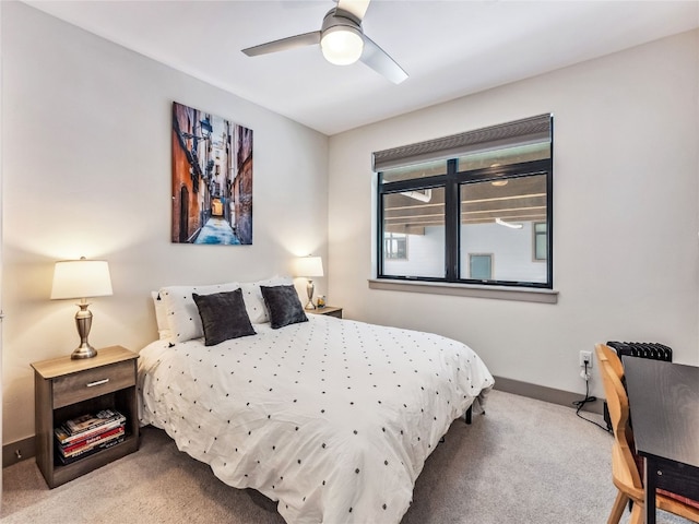 bedroom featuring ceiling fan and light colored carpet