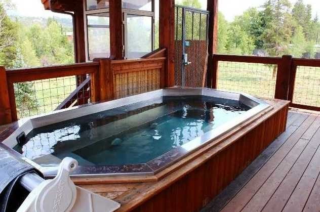 exterior space with an indoor hot tub