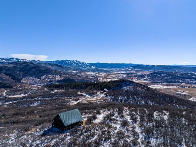 wooden deck featuring a mountain view