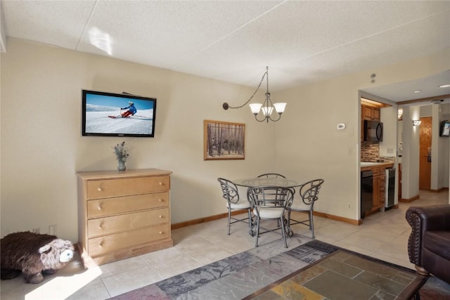 tiled dining room with beverage cooler, a chandelier, and a textured ceiling