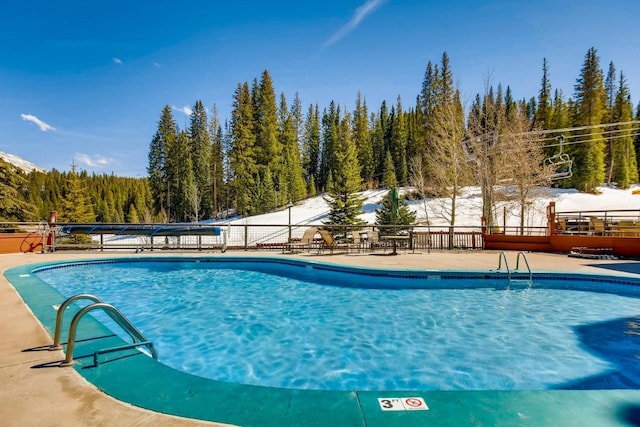 view of snow covered pool