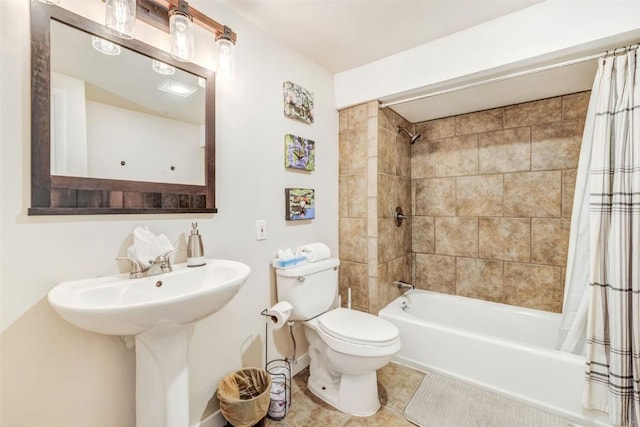 full bathroom featuring tile patterned flooring, toilet, shower / bathtub combination with curtain, and sink