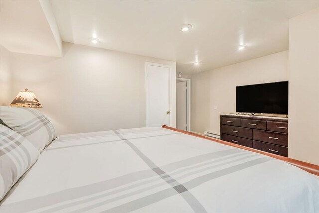 bedroom featuring a baseboard radiator