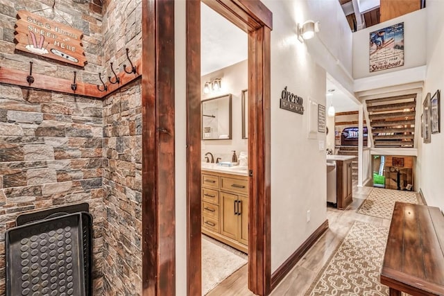 hallway with light hardwood / wood-style flooring