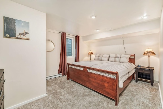 carpeted bedroom featuring a baseboard radiator