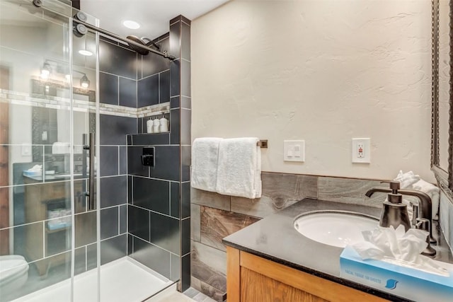 bathroom with vanity and walk in shower