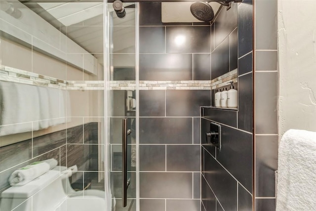 bathroom with a tile shower