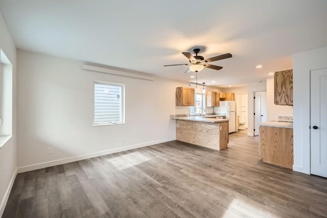 525 Castello Ave, Fairplay, CO 80440 - kitchen with a peninsula, freestanding refrigerator, a wealth of natural light, and ceiling fan