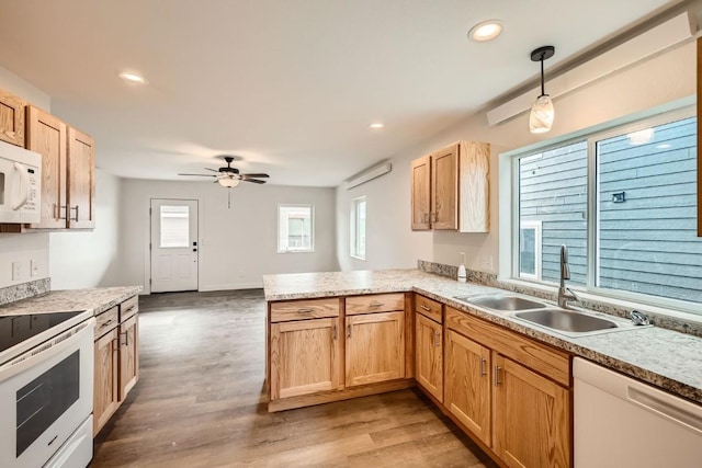 525 Castello Ave, Fairplay, CO 80440 - kitchen featuring plenty of natural light, a peninsula, white appliances, and a sink