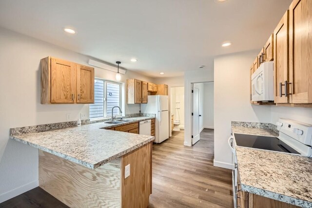 525 Castello Ave, Fairplay, CO 80440 - kitchen featuring baseboards, wood finished floors, a sink, and white appliances