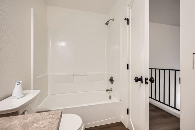 525 Castello Ave, Fairplay, CO 80440 - bathroom featuring shower / washtub combination, wood finished floors, and toilet