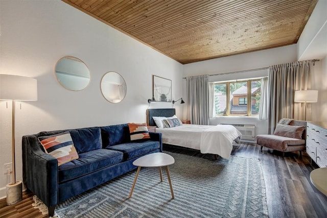 23110 US Highway 6 Unit 5056, Keystone, CO 80435 - bedroom featuring an AC wall unit, vaulted ceiling, wood finished floors, wooden ceiling, and ornamental molding