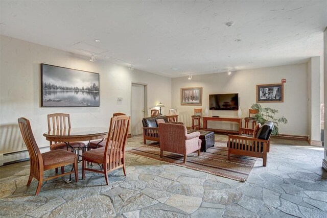 23110 US Highway 6 Unit 5056, Keystone, CO 80435 - dining area featuring stone floors and rail lighting