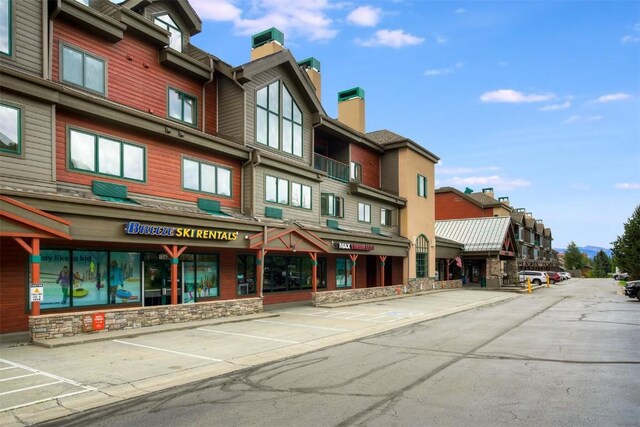 23110 US Highway 6 Unit 5056, Keystone, CO 80435 - view of building exterior with uncovered parking