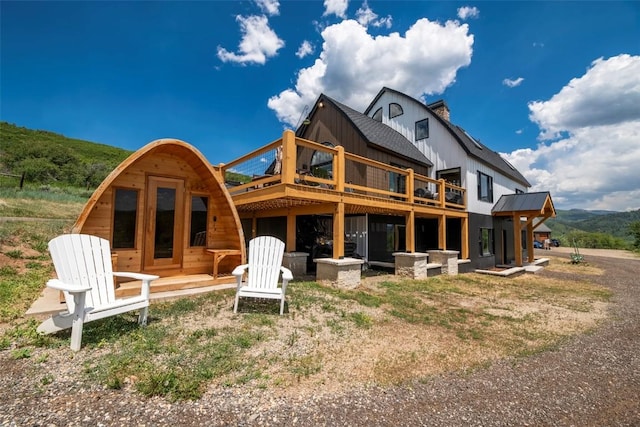 44255 Diamondback Way, Steamboat Springs, CO 80487 - rear view of property featuring a deck and a chimney
