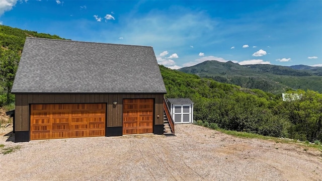 44255 Diamondback Way, Steamboat Springs, CO 80487 - detached garage featuring a mountain view and a forest view