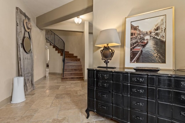 40924 Purple Sage St, Steamboat Springs, CO 80487 - corridor featuring baseboards, stone finish floors, and stairs