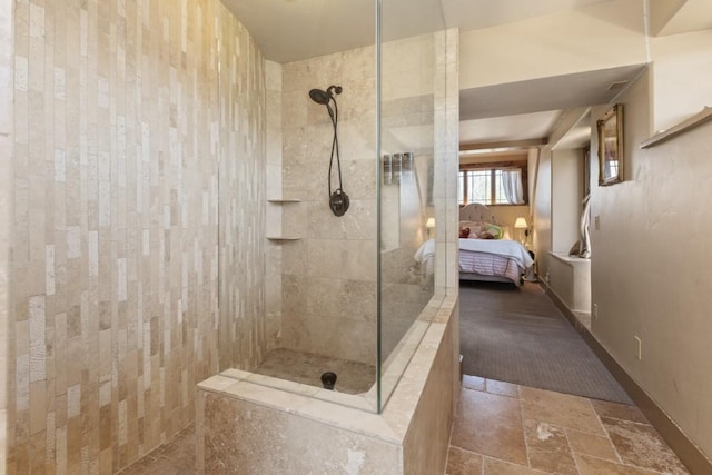 40924 Purple Sage St, Steamboat Springs, CO 80487 - bathroom featuring ensuite bath, a walk in shower, and stone tile floors