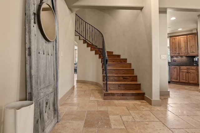 40924 Purple Sage St, Steamboat Springs, CO 80487 - staircase with stone tile flooring, baseboards, and recessed lighting