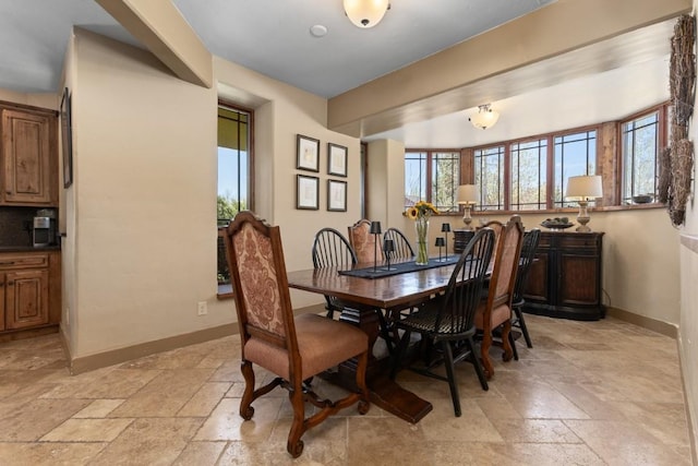 40924 Purple Sage St, Steamboat Springs, CO 80487 - dining space with stone tile flooring and baseboards