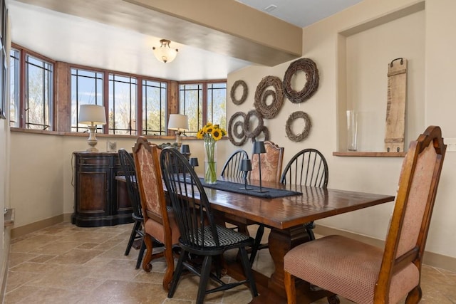 40924 Purple Sage St, Steamboat Springs, CO 80487 - dining space with baseboards and light stone finish floors