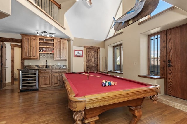 40924 Purple Sage St, Steamboat Springs, CO 80487 - recreation room with wine cooler, wet bar, dark wood-type flooring, billiards table, and a towering ceiling